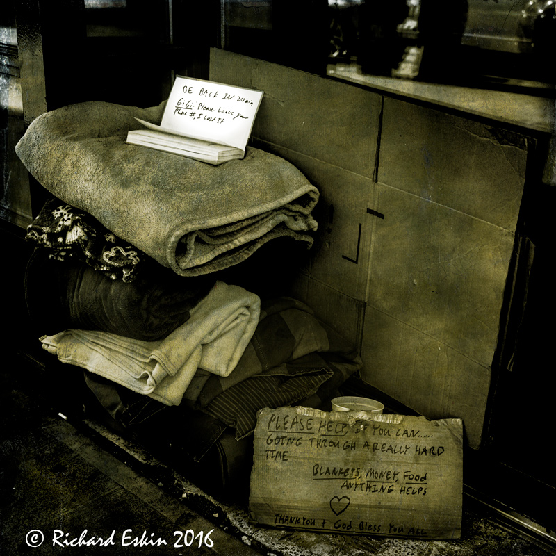 I saw these possessions sitting on the street, all neatly folded and piled, with a note to an acquaintance and a begging sign. It told one story, but I couldn't help but wonder, what the story would have been if I could talk to the owner.